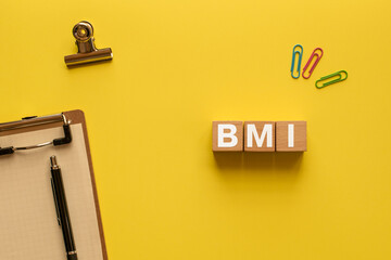 Poster - There is wood cube with the word BMI. It is an abbreviation for Brain Machine Interface as eye-catching image.