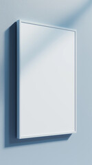 Poster - White frame mockup hanging on blue wall with sunlight shadow