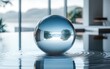 © ali - Minimalist Glass Orb Display with Smooth Water Reflection in Soft Lighting