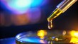 © kukuh - A Droplet of Yellow Liquid Falling from a Pipette