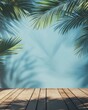 © adri - Tropical palm leaves shadow on blue wall background with wooden floor.