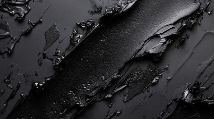 Poster - A textured black surface with varied finishes and layers, suggesting depth and contrast.