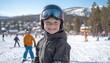© hakule - Young skier smiles on a snowy slope during a sunny day at a popular mountain resort with other skiers in the background