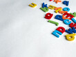© Ламина Акулова - Colorful magnetic letters on white background for education and learning
