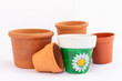 © GreenThumbShots - Set of empty small miniature clay flower pots isolated on white background