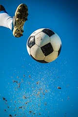 Wall Mural - Soccer Ball Being Kicked in Mid-Air Against Clear Sky 