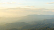 © Log - Breathtaking mountain landscape with soft sunlight illuminating peaks and valleys, creating serene and tranquil atmosphere