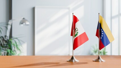 FLAGS OF PERU AND VENEZUELA ON TABLE