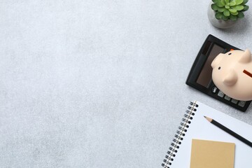top above overhead view photo of office accessories calculator, notebook and pencil on gray backdrop