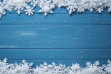 Poster - Christmas composition forming a frame with snowflakes and snow on blue wooden background
