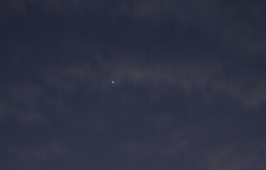 Wall Mural - venus star on twilight blue sky with dark cloud in evening