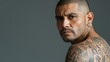 © Sintrax - Portrait of a Hispanic Gang Member Covered with Tattoos