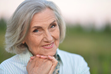 Canvas Print - Portrait of a beautiful elderly woman in the park