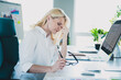 © deagreez - Photo of successful manager business analytic blonde lady wearing white shirt overworked feeling stressed at her office job