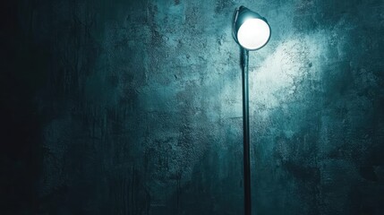 Poster - Stylish Wall Lamp with Soft Light Against Dark Concrete Background