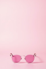 Poster - Pastel colored background with glasses placed delicately upon it creating a visually appealing and serene atmosphere instantly._00003_