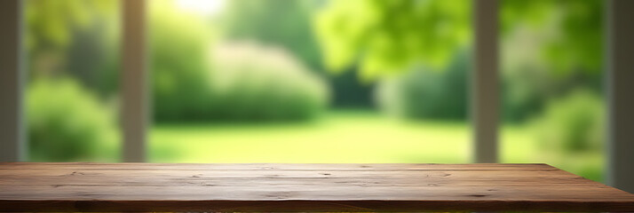 Poster - A worn wooden table sits in front of a blurred garden view with vibrant green foliage seen through the window._00001_
