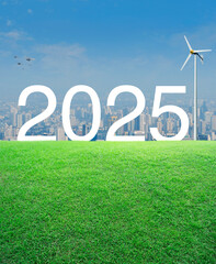 Wall Mural - 2025 white text with wind turbine on green grass field over modern city tower and skyscraper, Happy new year 2025 ecological cover concept