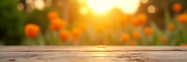 Poster - A wood table top displays a blurred image of an orange garden scene during the early morning hours outside._00001_