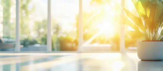 Poster - Bright and airy living room with sunlight streaming through large windows showcasing greenery and a tranquil ambiance for background use