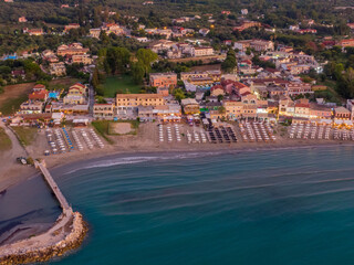 Wall Mural - Aerial view of coastal town with beach and pier at dusk