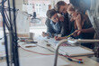 © Geber86 - Young people working on a project together in a startup company office