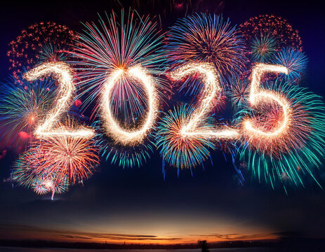 Fireworks explosions in the shape of 2025. Against the background of dark sky.