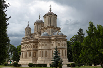 Wall Mural - Romania Curtea de Arges view on a cloudy summer day