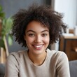 © Marta  Maksymiv - Head shot portrait smiling woman making video call to friends or relatives, using webcam, sitting on couch at home, happy young female blogger recording vlog, looking at camera, chatting online