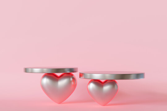 3D rendered Valentine's Day-themed product display with two metallic heart-shaped bases with round platforms on soft pink background. Perfect for showcasing luxury products, gifts. Minimalist design.