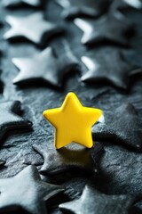 Poster - A single yellow star sits atop a pile of black stars, offering a ray of hope in the darkness