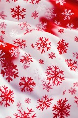 Aufkleber - A close-up of a red and white snowflake print fabric