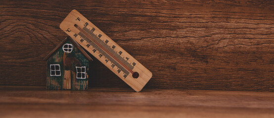 Wall Mural - house model with wooden blocks on a wooden table. mortgage and real estate concept.