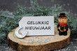 © Racamani - Nieuwjaarswenskaart: schoorsteenveger met hoefijzer en de tekst Gelukkig Nieuwjaar.