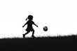 © Serhii - Dynamic Young Boy Silhouette Engaging in Football Play with a Joyful Spirit