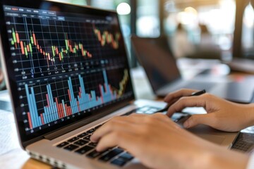 Poster - Businesswoman analyzing stock market data on a laptop screen, tracking financial trends and making investment decisions
