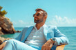 © romanets_v - Young caucasian male relaxing by the ocean in stylish suit on a sunny day