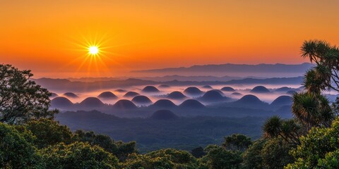 Canvas Print - Breathtaking Orange Sunrise Over Lush Forest and Misty Hills in Tropical Landscape, Capturing Serenity and Beauty with a Vivid Sky and Rolling Hills, Nature's Splendor