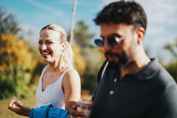 Poster - A joyful moment captured as two friends spend a relaxing day outdoors. They are enjoying the sunshine and the company in a natural environment, cherishing their friendship.