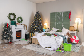 Wall Mural - Interior of messy bedroom after New Year party with tinsel and mop