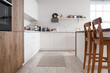 © Pixel-Shot - Interior of stylish light kitchen with modern furniture