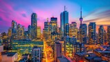 Business skyscrapers rise high in Financial District as the sun sets, casting a golden glow over the glass towers. The vibrant skyline reflects Toronto's position as a global financial hub.