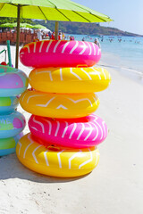 Wall Mural - Inflatable rings on the beach