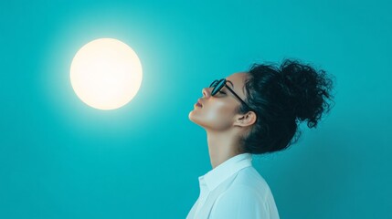 Poster - Modern Serenity Contemplative Woman with Glowing Light Orb on Blue