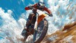 © Ali - Motocross rider speeding, dirt flying, sunny sky.