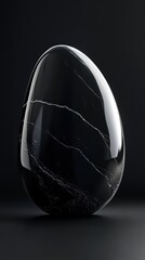Poster - Sleek obsidian stone featuring deep black surface with subtle veins illuminated against a dark background