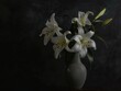 © Сергей Кошкаров - Lilies in a vase on a dark background, emphasizing sophistication and elegance, soft natural light.