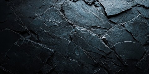 Poster - Dark slate rock background featuring a textured surface illuminated by a spotlight. This dark slate rock texture provides a unique visual experience with its dramatic lighting.