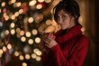 © Сергей Кошкаров - Woman in a red sweater holding a gift, showcasing the festive warmth, soft artificial lighting.