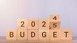 © Sewupari Studio - Flip wooden block cube for change 2024 to 2025 Budget for money planning and allocation concept